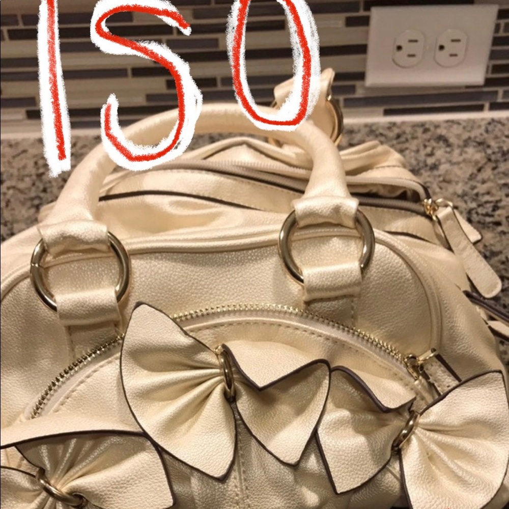 ISO Charming Charlie Ivory Pearlescent and Gold Vinyl Bow Bag